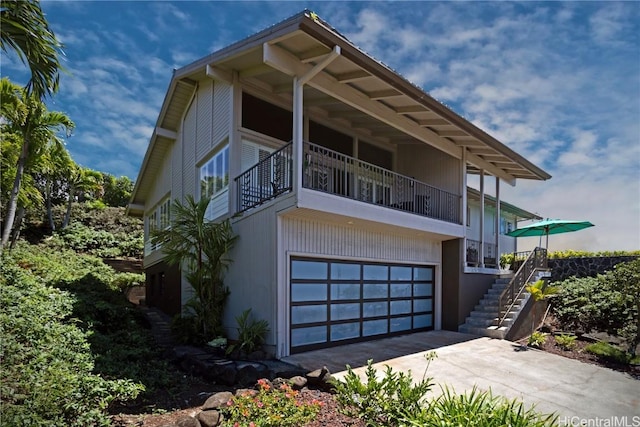 view of side of property with a garage