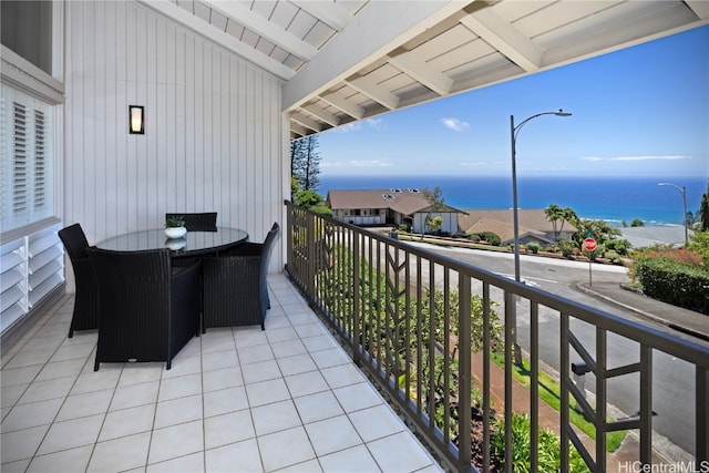 balcony featuring a water view