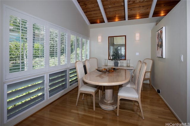 dining room featuring beamed ceiling, hardwood / wood-style flooring, high vaulted ceiling, and wooden ceiling