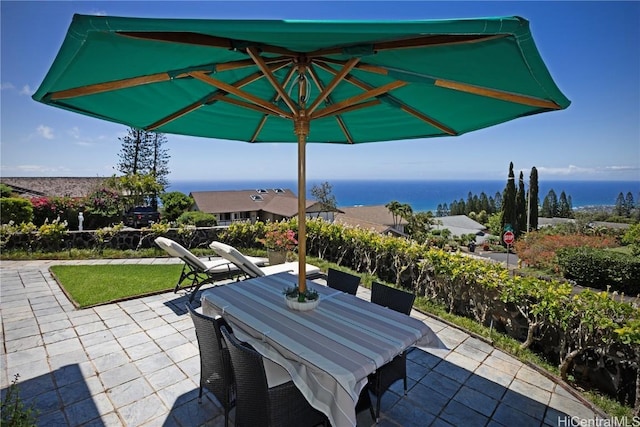 view of patio featuring a water view