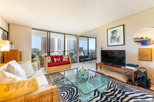 living room featuring a textured ceiling and floor to ceiling windows