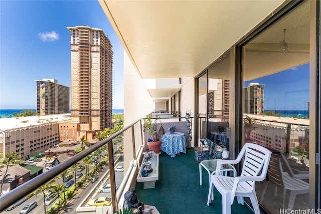 balcony featuring a water view