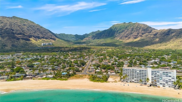 mountain view featuring a water view and a view of the beach