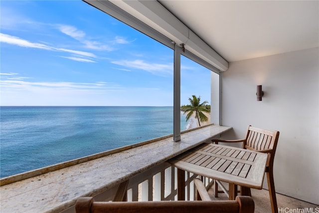 balcony featuring a water view