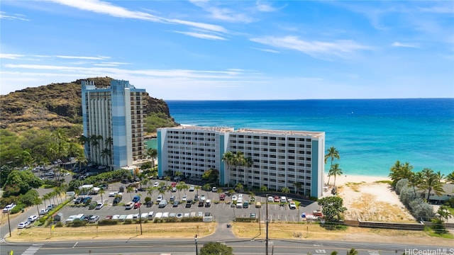 aerial view featuring a view of the beach and a water view