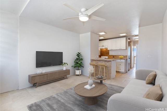 tiled living room featuring ceiling fan