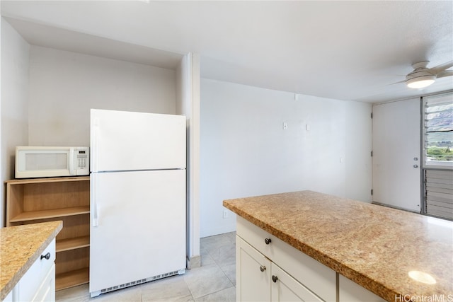 kitchen featuring white cabinetry, light tile patterned floors, white appliances, and ceiling fan