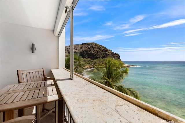 balcony featuring a water view