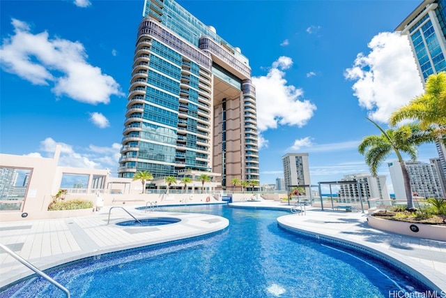 view of swimming pool featuring a patio area