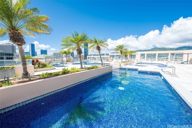 view of swimming pool featuring a patio area