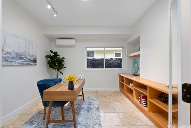 interior space featuring rail lighting and a wall unit AC