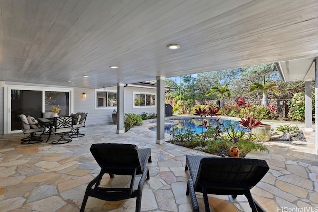 view of patio / terrace with a fenced in pool