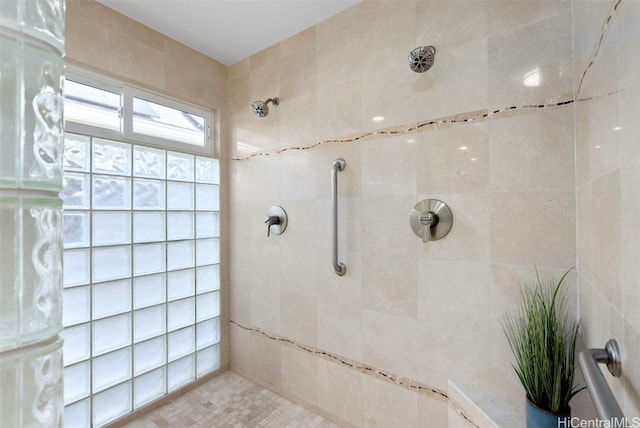 bathroom with tiled shower