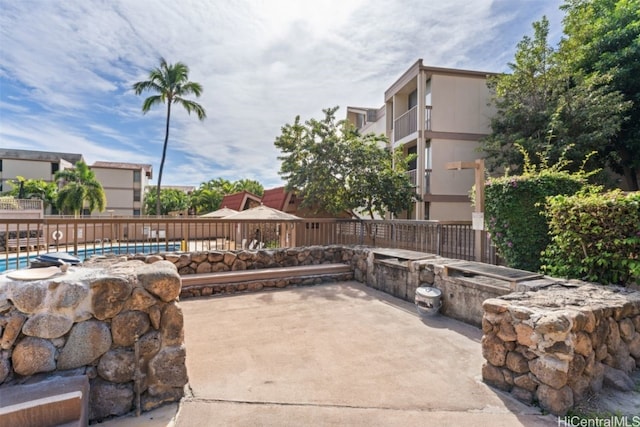 view of patio / terrace with a fenced in pool