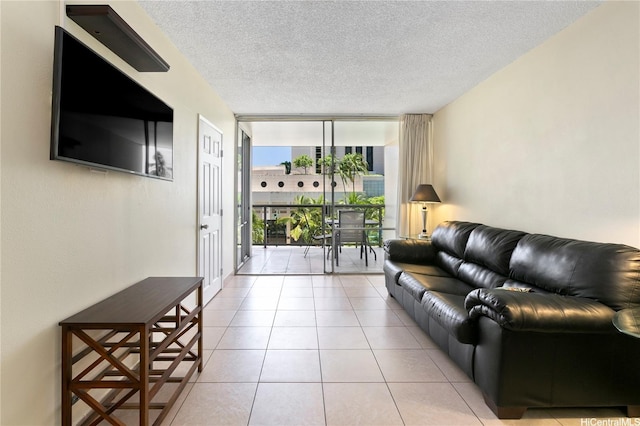 1684 Ala Moana Blvd Unit 352, Honolulu, HI 96815 - living room with expansive windows, a textured ceiling, and light tile patterned floors