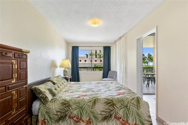 tiled bedroom with a textured ceiling