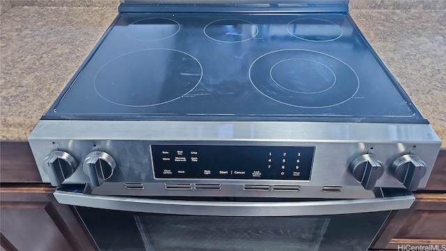 exterior details featuring mail area, blue cabinetry, and stainless steel stove