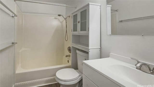 full bathroom featuring washtub / shower combination, vanity, and toilet