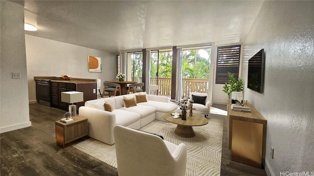 living area featuring a textured ceiling, a textured wall, dark wood finished floors, and baseboards