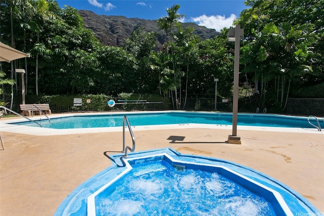 84-664 Ala Mahiku St Unit 196C, Waianae, HI 96792 - pool with a mountain view, fence, a patio area, and a hot tub