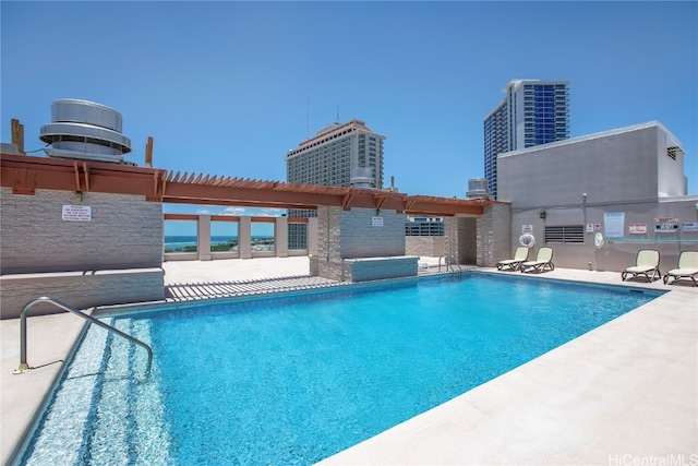 view of pool featuring a patio area