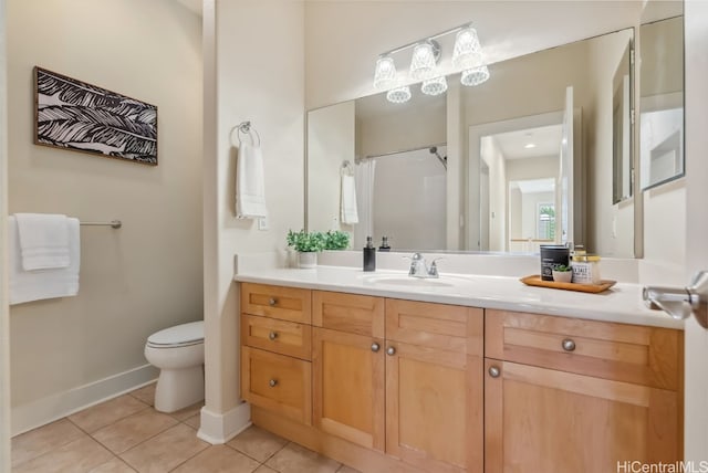 bathroom featuring tile patterned floors, vanity, and toilet