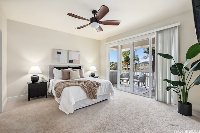 carpeted bedroom featuring access to exterior and ceiling fan