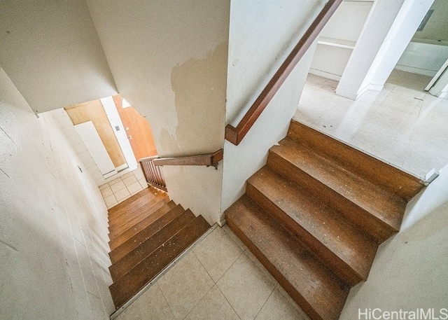 staircase featuring hardwood / wood-style flooring