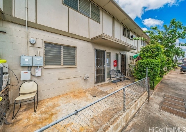 view of property exterior with a patio area