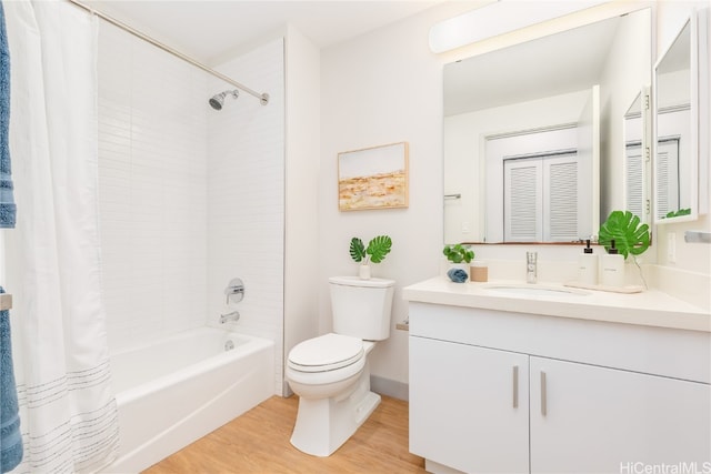 full bathroom featuring vanity, toilet, wood-type flooring, and shower / tub combo with curtain