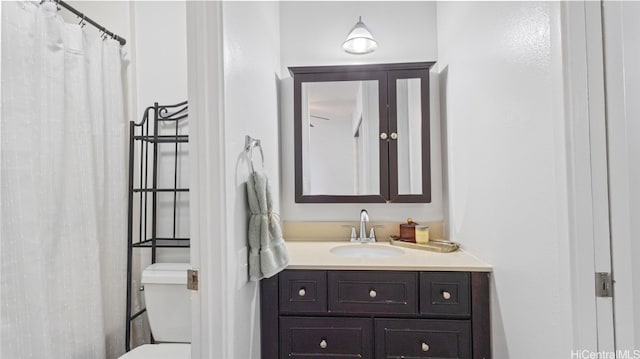 bathroom with vanity and toilet