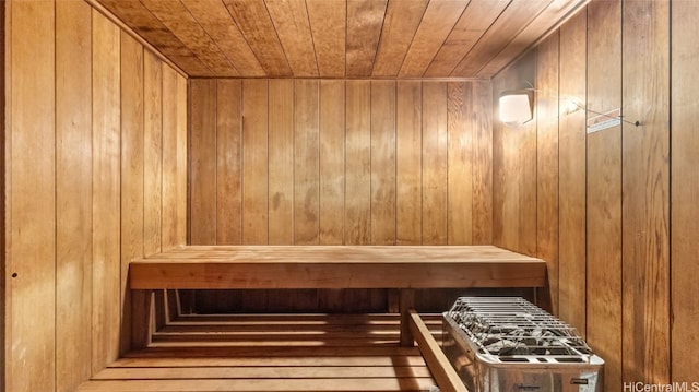 view of sauna / steam room with wooden walls and wooden ceiling