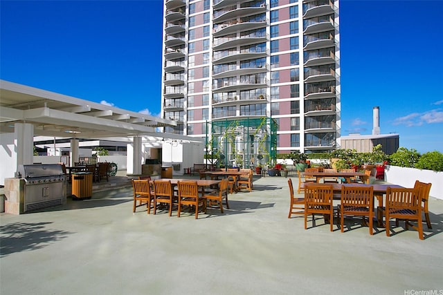 700 Richards St Unit 907, Honolulu, HI 96813 - view of patio featuring a pergola, outdoor dining area, and area for grilling