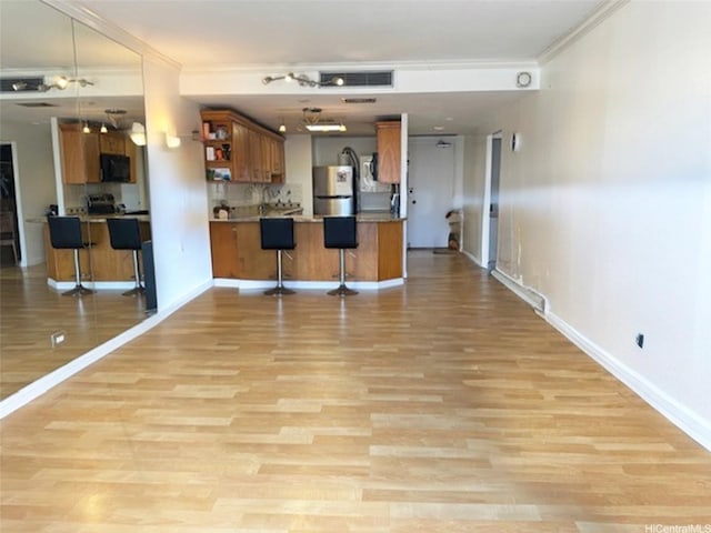 700 Richards St Unit 907, Honolulu, HI 96813 - interior space with baseboards, crown molding, light wood-style floors, and visible vents