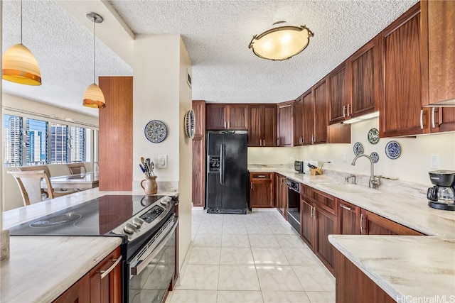 kitchen with a textured ceiling, light stone countertops, black appliances, pendant lighting, and sink