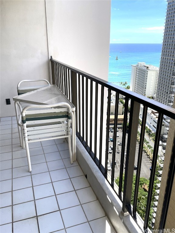 balcony featuring a water view