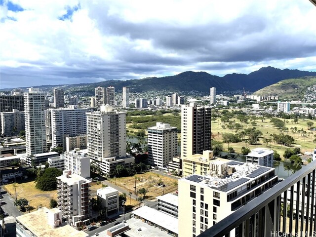 property's view of city featuring a mountain view