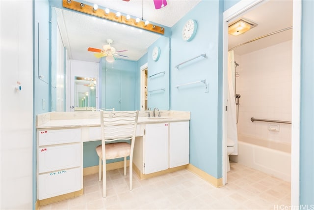 full bathroom with ceiling fan, a textured ceiling, toilet, shower / tub combo with curtain, and vanity