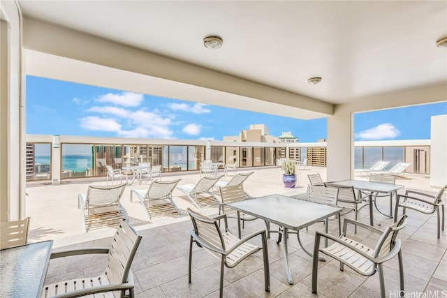 view of patio with a water view