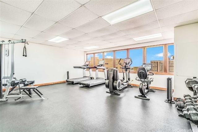 exercise room featuring a drop ceiling