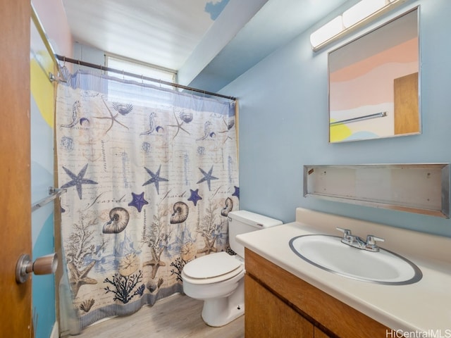 bathroom featuring vanity, a shower with curtain, wood-type flooring, and toilet