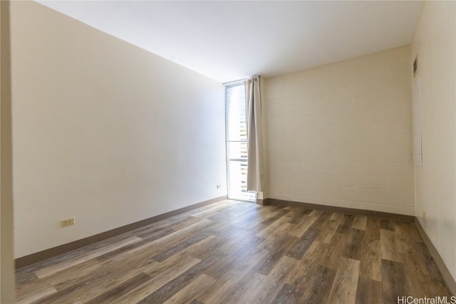 empty room featuring dark wood-type flooring