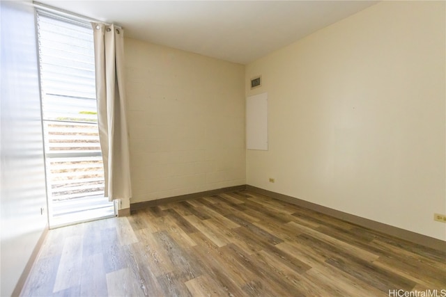 empty room with wood-type flooring