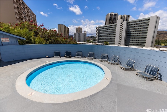 view of pool featuring a patio area