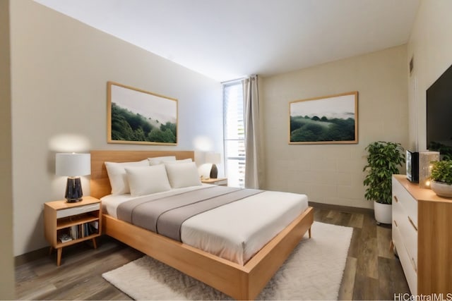 bedroom featuring dark hardwood / wood-style floors