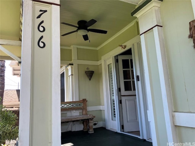 doorway to property featuring ceiling fan