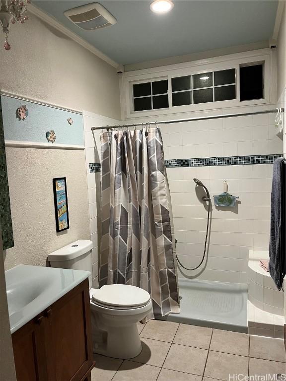 bathroom with a shower with shower curtain, tile patterned floors, toilet, vanity, and ornamental molding