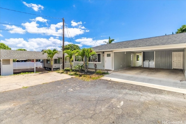 ranch-style home with a carport