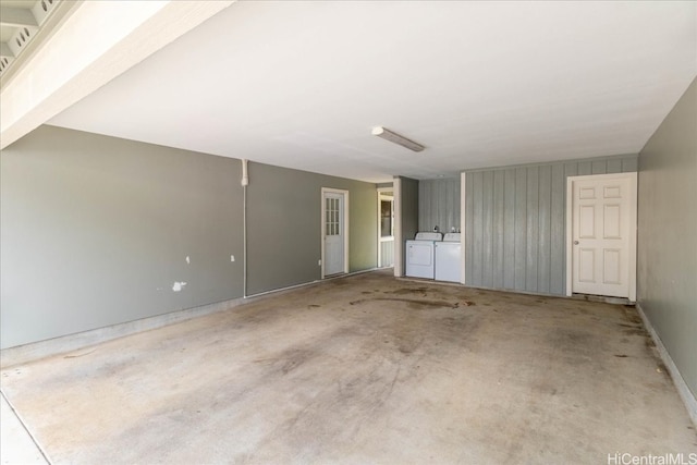 garage with washer and clothes dryer