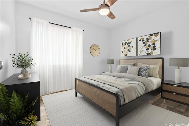 bedroom featuring light hardwood / wood-style floors and ceiling fan